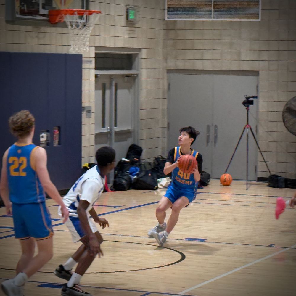 Ethan squaring up to shoot from the wing during a varsity game